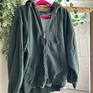 Brandy Melville emerald green zip up Jacket.
Baggy fit.